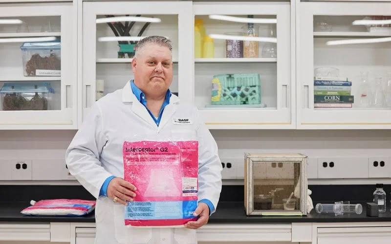 A portrait of James Austin holding an Interceptor G2 insecticide treated bed nets in one of the labs on the BASF campus in Durham, NC.